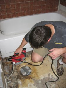 Cutting Away the Water Damaged Subfloor