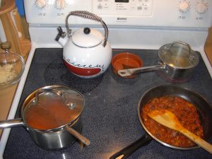 Sauce and pork filling cooking on the stove.