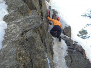 Dave climbing a hard, thin, mixed route.