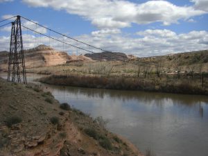 What's left of the old Dewey Bridge—an historical landmark and a lesson about the dangers of fire in the dry desert. You can still see little bits of the decking hanging from the suspension wires.