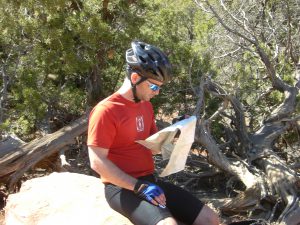 Pete scanning the map to find the best route option.