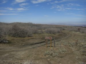 Back to dirt, it was pretty much all downhill from here. The road wouldn't stay this rutted and money for too long.