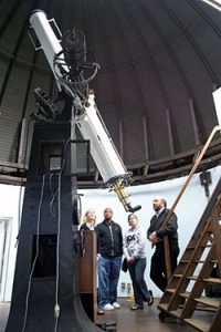 Dan (Dr. Fleisch) with some students next to the 11" Lundin refractor in Weaver Observatory.