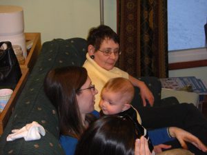 Leah with Mia and Jess's mom Betti enjoying the show from the couch.