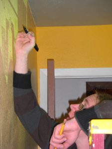 Jess painting and tracing Marvin onto the walls. Look at that pregnant lady on a ladder with a Sharpie and a pencil.