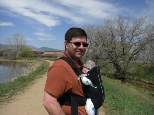 Daddy carries Phoebe on our walk.
