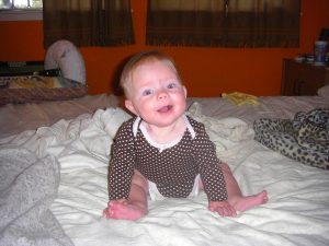 Sitting up on the bed like a big girl!