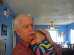 A comforting thumb-suck and Grandpa!