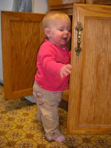 Playing in the cupboard.