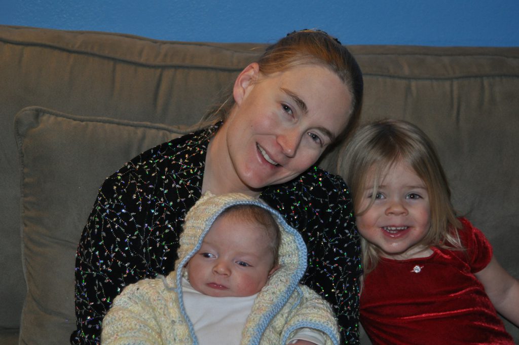 Here's Jess on the couch with her two kiddos. No number of photos would have gotten Benjamin to look at the camera.