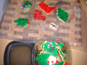 Phoebe did a great job icing Christmas cookies!