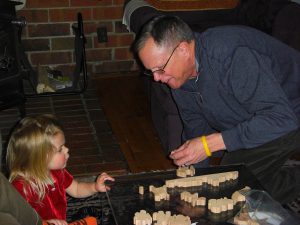 Phoebe and Pappy work on Uncle Matt's monkey puzzle.