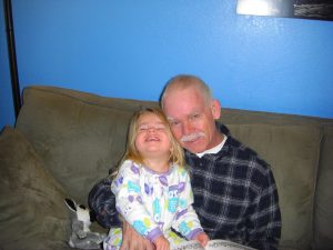 Grandpa and Phoebe in her owl pajamas.