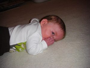 Tummy time turns out to be a great time to suck your thumb and relax.