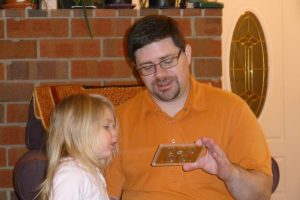 Checking out Daddy's new coins.