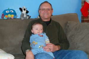 Is Benjamin watching TV while Pappy poses?