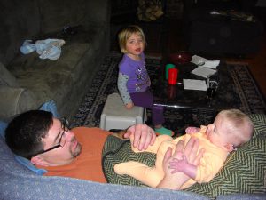 Hanging out with Daddy while Phoebe finishes up her milk and water.