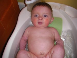 Happy boy in the bathtub.
