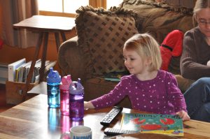 Charlotte checks out the matching water bottles.