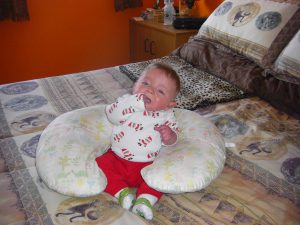 Early sitting up with the Boppy.