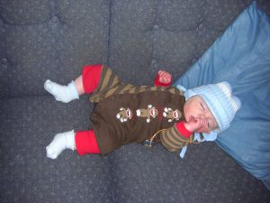 Conked out after a trip in the baby carrier to the grocery store.