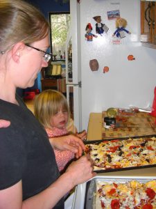 Baking homemade pizza.