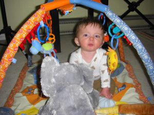 Playing with his new, huge, super-soft elephant, courtesy of the hospital auxillary group.