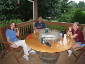 Erin, Matt, and Jess sitting around the dinner table.