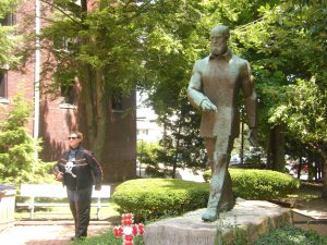 Elaina, striding purposefully along with Januarius A. MacGahee.