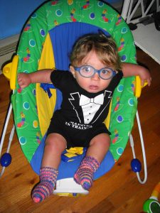 Benjamin likes to sit upright in his bouncy chair these days.