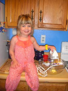 Phoebe helps make her birthday cake in the cutest new outfit from our mother-daughter shopping trip!