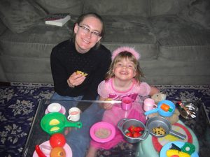 A princess tea party complete with pink princess punch from Hawaii (thanks, Karen!), cookies, and plastic food.