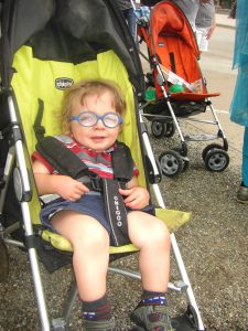 Having fun, even stuck in the stroller.