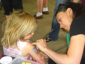 Getting a butterfly painted.