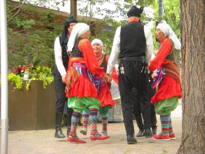 The men and women joined together for a dance.