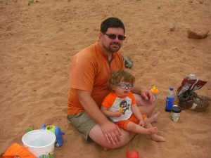 Daddy and Benjamin in the sand.