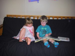 Phoebe loves to be read to. She doesn't seem to find Henry's abilities as novel as the grown-ups do!