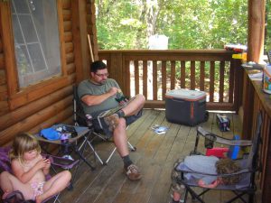 Relaxing on the porch in the morning. We had only light electronics with us, which was lovely.