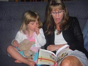 Grammie reads Phoebe Frog and Toad.