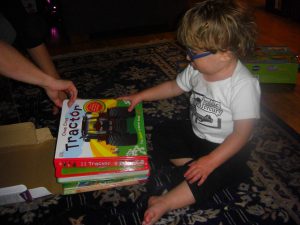 Opening one of the many books with sound we thought Benjamin would like. (We were right.)