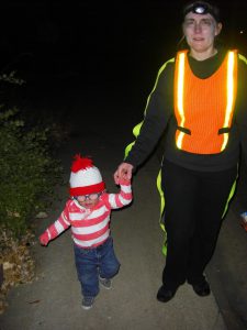 Dead guy with safety vest walking Waldo from door to door. He had a great time following the other kids.