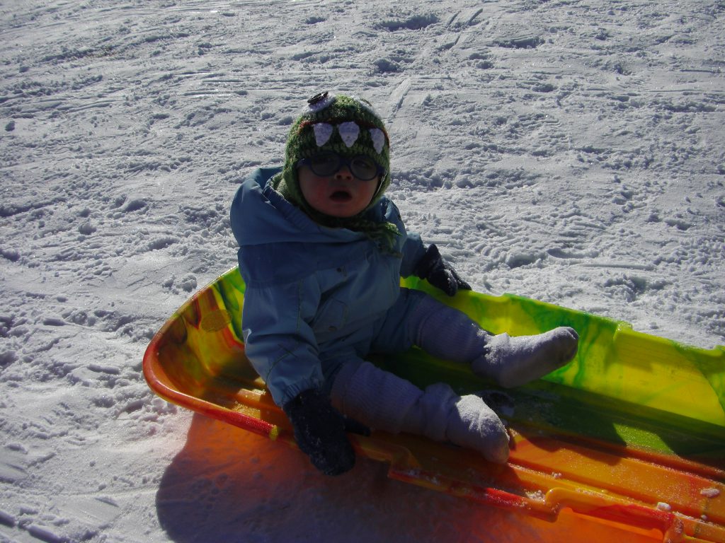 Benjamin in the toboggan. Don't worry, we didn't send him down the hill solo.