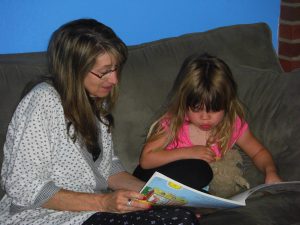 Grammie reading with Phoebe.
