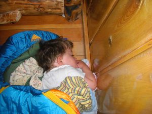 Benjamin slept in his Woobie (tiny sleeping bag) on the floor in the bedroom.