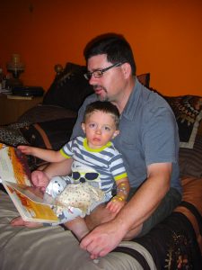 Daddy reading a bedtime book.