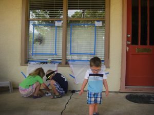 Getting ready to paint their Halloween windows.