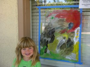 Phoebe with her painting.