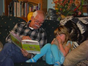 Grandpa reading to Phoebe.