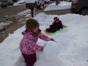 The kids had to be dragged out the house to build a snowman. The snow was higher than Benjamin's waist!