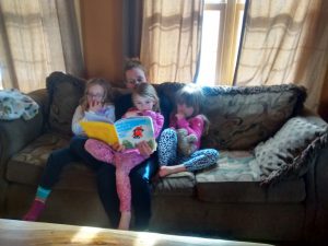 Kelli reading to the girls.